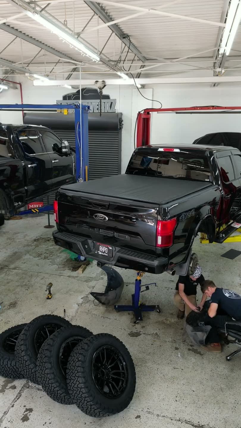A pair of red performance coilover shocks